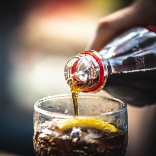 refreshing-beverage-poured-into-a-glass-with-lemon